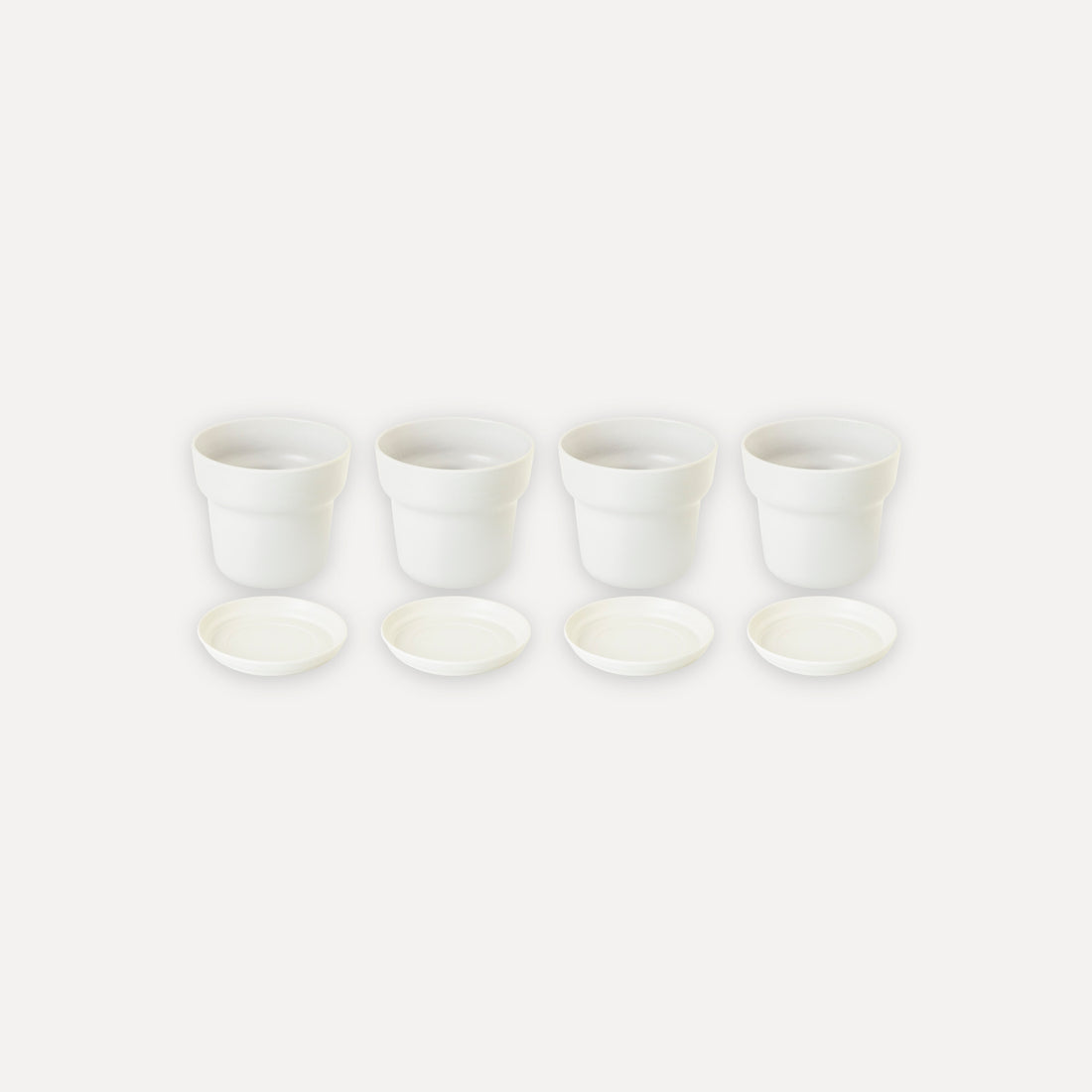 Set di 4 vasi con piatto di base
