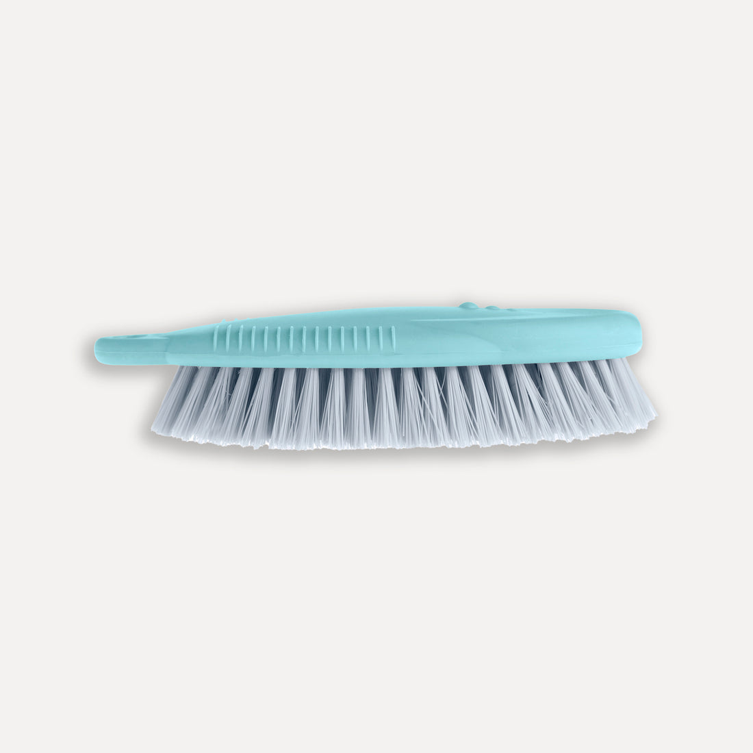 Ergonomic brush with hard bristles